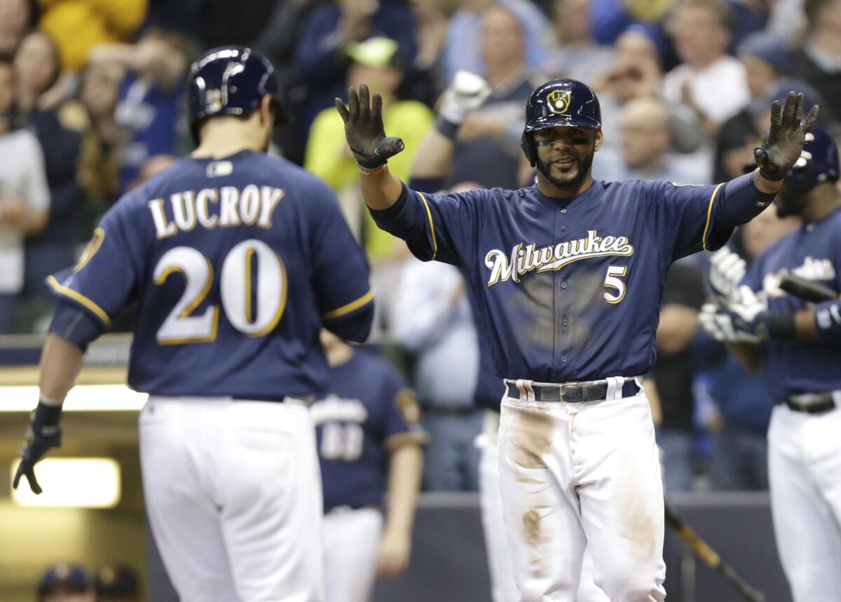 Brewers catcher Jonathan Lucroy (20) heads to home plate after hitting a two-run home run against the Angels in the fifth inning of a game May 3.