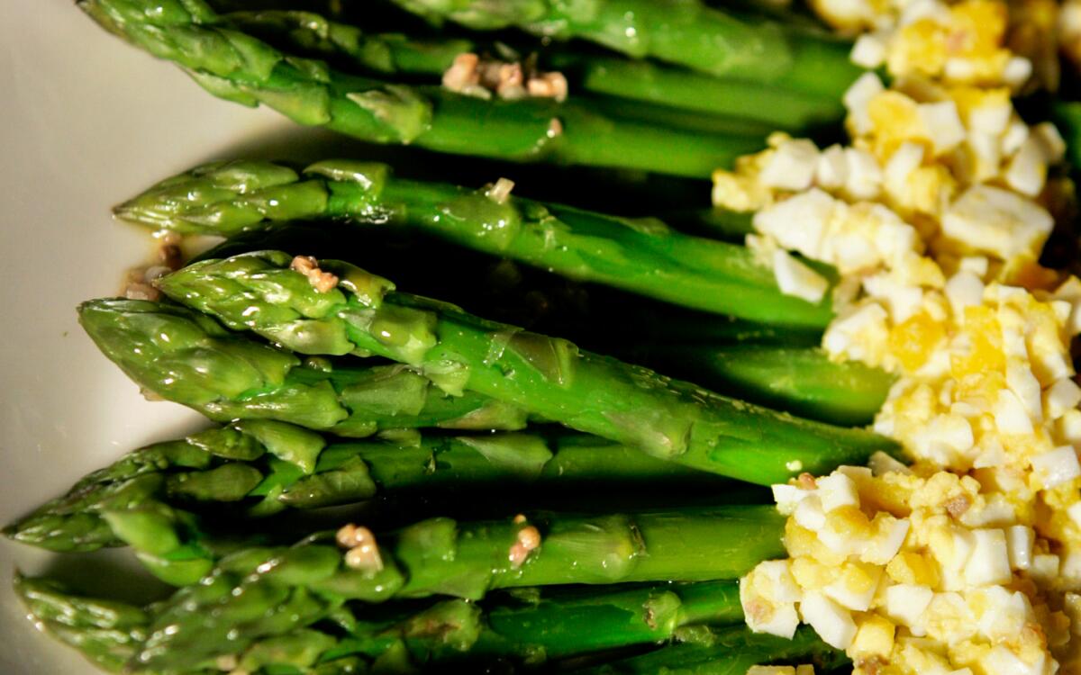Easter sides -- asparagus spears with chopped egg and anchovy.
