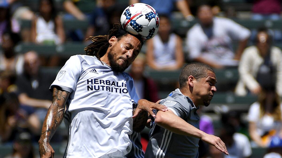 Galaxy midfielder Jermaine Jones sends a header away from Sounders midfielder Osvaldo Alonso during a game in April at StubHub Center.