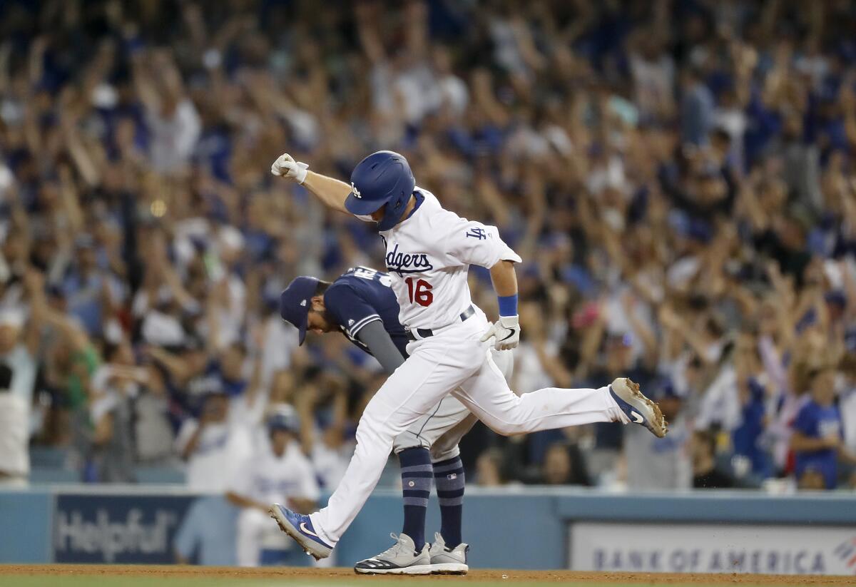 Dodgers catcher Will Smith rounds the bases after hitting a grand slam against the San Diego Padres in the sixth inning Thursday at Dodger Stadium.