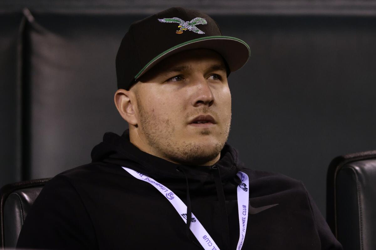 Angels star Mike Trout wears a Philadelphia Eagles hat while attending a game between the Eagles and Dallas Cowboys.