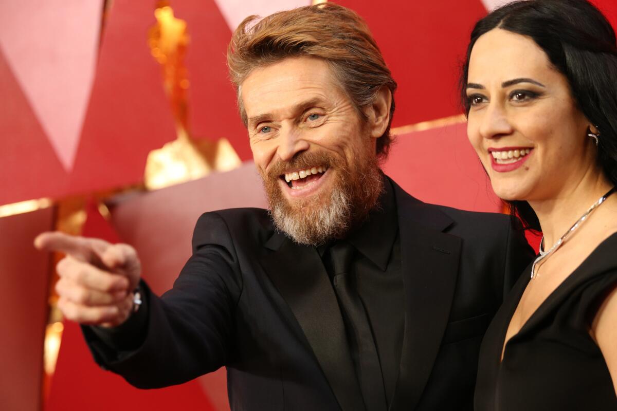 "The Florida Project" nominee Willem Dafoe and his spouse, director Giada Colagrande, smile for the cameras during the arrivals at the 90th Academy Awards.
