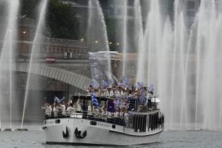 Team Greece's boat parades along the Seine river in Paris, France, during the opening ceremony.