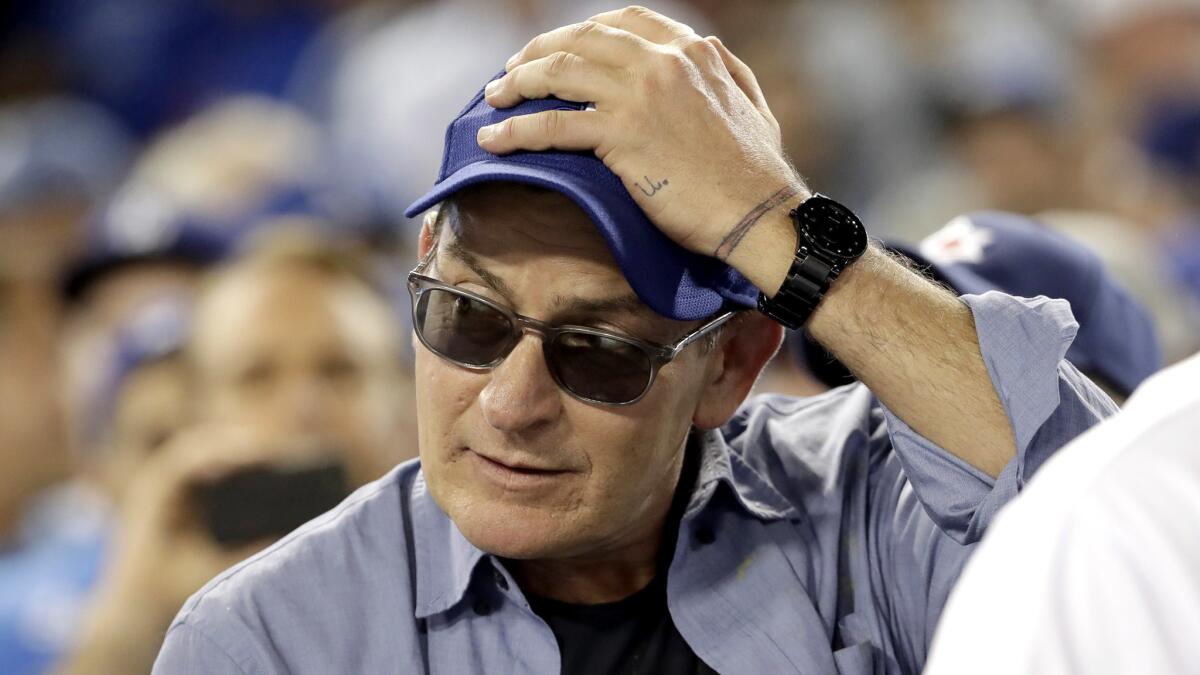 Charlie Sheen reacts to a play during Game 4 of the National League Championship Series between the Dodgers and Cubs last fall.