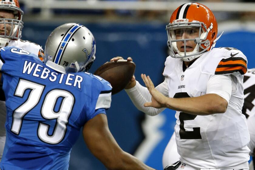 Browns quarterback Johnny Manziel looks to pass under pressure from Lions defensive end Larry Webster during the preseason opener last week in Detroit. Manziel will come off the bench again this week against Washington.