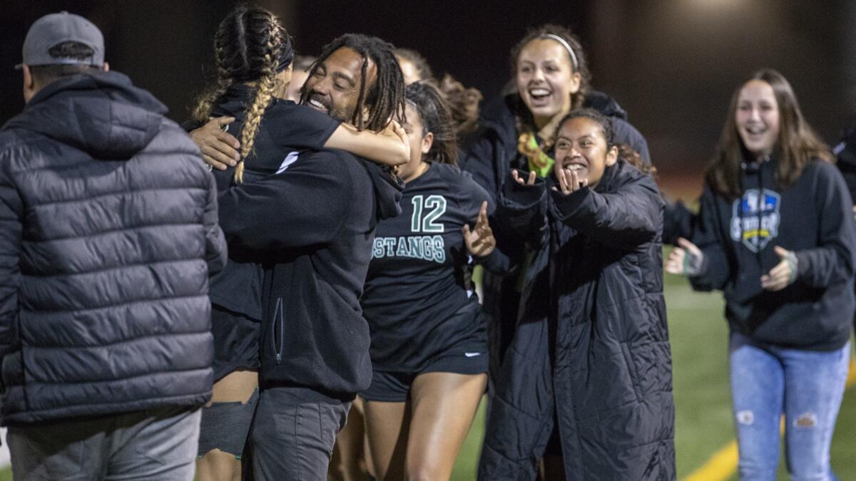 Costa Mesa High head coach Jason Boyce, shown hugging Natalia Guzman during a match Feb. 12, said he is excited about the team's future after Saturday's 1-0 loss. "We have a great defense and should only get better the next few years," he said.