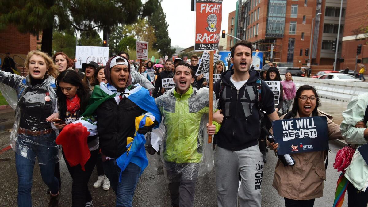 Demonstrators at an anti-Trump rally march through campus at UCLA.