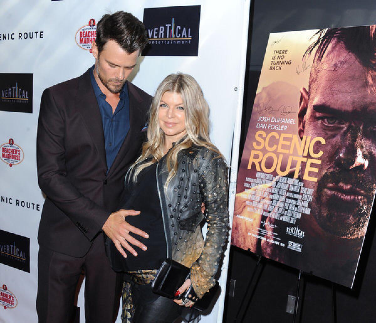 Josh Duhamel and his wife Fergie arrive on the red carpet for the premiere of "Scenic Route" in Los Angeles.