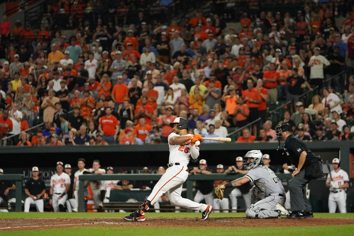 Baltimore Orioles' Adam Frazier follows through on a swing during