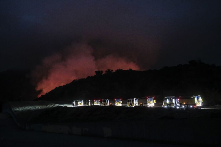 Arcadia, CA, September 13, 2020 - A line of California OES engines head to the flaming Santa Anita Canyon as the Bobcat Fire burns near Arcadia. (Robert Gauthier/ Los Angeles Times)