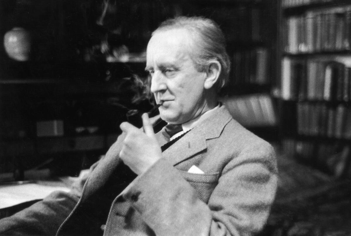 British writer J R R Tolkien (1892 - 1973), enjoying a pipe in his study at Merton College, Oxford, Dec. 2, 1955.