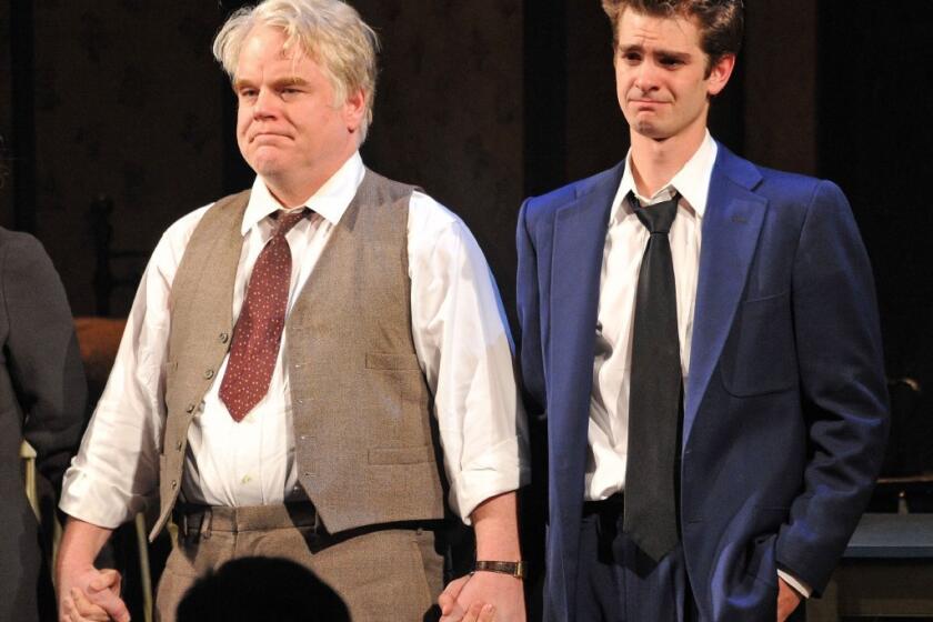 Philip Seymour Hoffman at a curtain call for "Death of a Salesman" on Broadway, with costar Andrew Garfield.