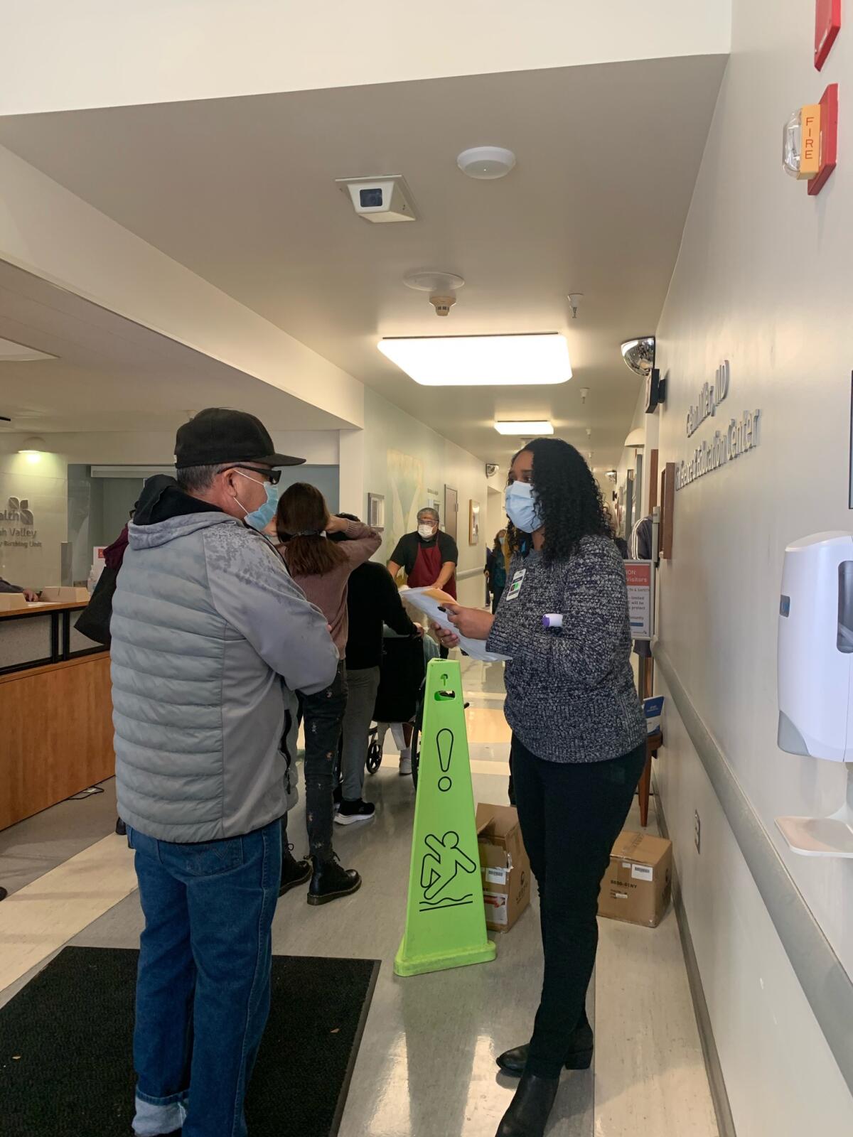 Residents in Ukiah line up for a COVID-19 vaccine after a freezer storing it broke down.