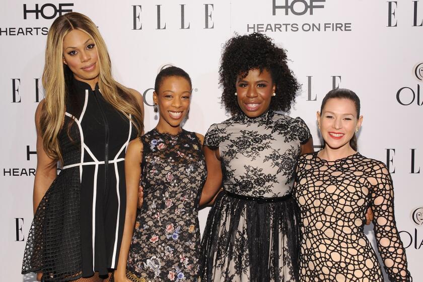 Actress Laverne Cox, left, recently told Katie Couric that "the preoccupation with transition and with surgery objectifies trans people." Cox is seen alongside Samira Wiley, Uzo Aduba and Yael Stone at Elle's annual Women in Television Celebration in West Hollywood on Jan. 22.