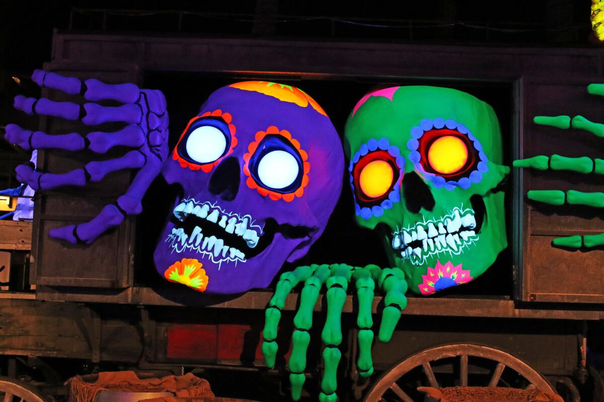 A pair of glowing skulls popping out at Halloween Horror Nights at Universal Studios