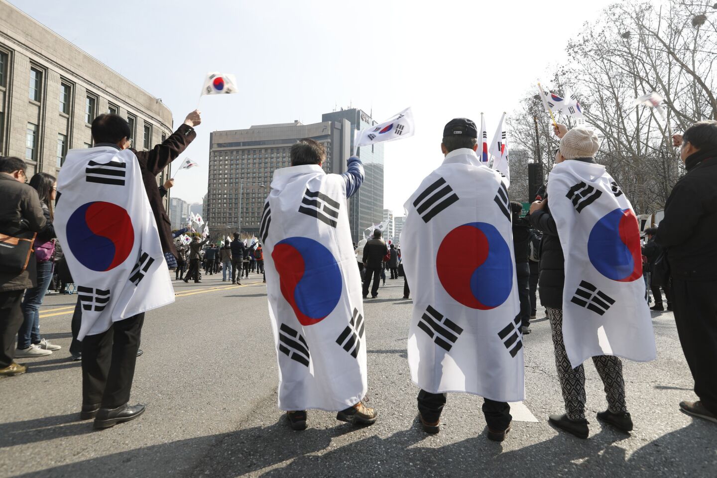 Supporters of former South Korean President Park Geun-hye protest her impeachment at Seoul City Hall on Saturday.