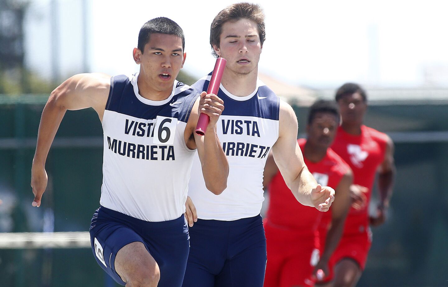 Vista Murietta's Jordan Testerman takes the baton from teammate Cole Dubbots to anchor their victory in the Divison 1 boys' 4x100-meter relay during the CIF Southern Section finals at Cerritos College.