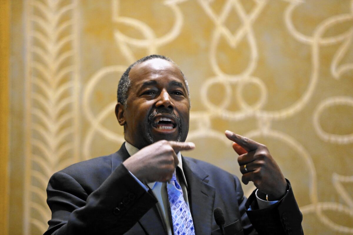 Republican presidential candidate Ben Carson makes a brief stop to speak to the media Dec. 10, 2015, after an event at the Peninsula Hotel in Chicago.