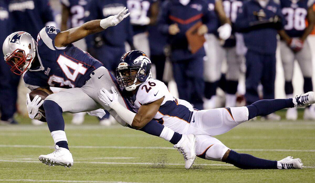 Broncos safety Rahim Moore brings down Patriots running back Shane Vereen (34) in the second half Sunday.