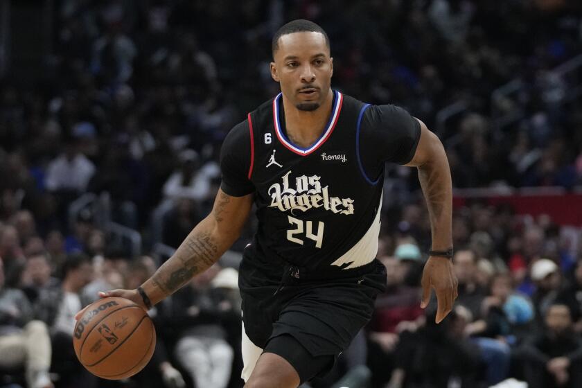 Los Angeles Clippers forward Norman Powell (24) controls the ball during an NBA basketball game against the San Antonio Spurs in Los Angeles, Thursday, Jan. 26, 2023. (AP Photo/Ashley Landis)