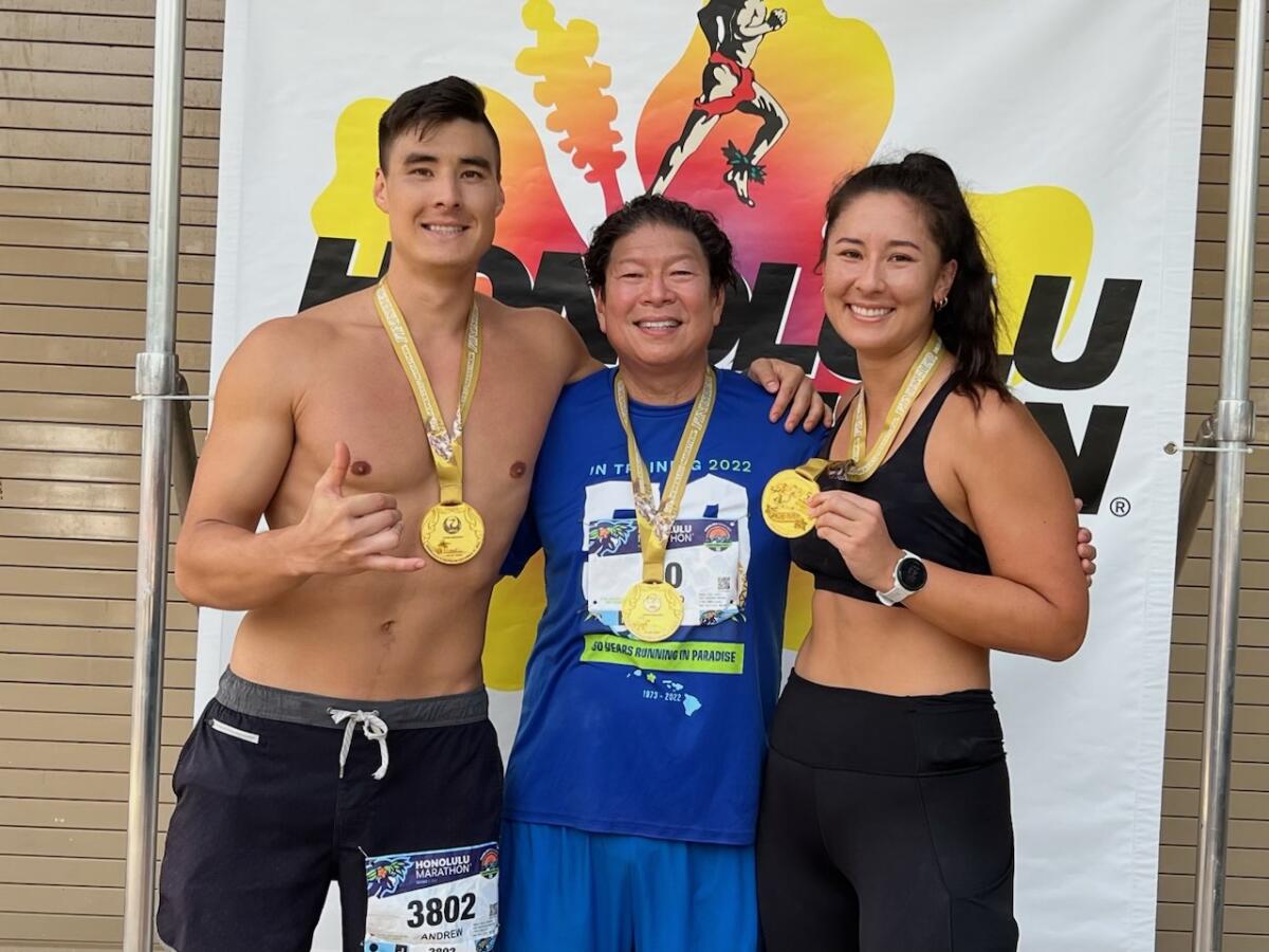 Dr. Jerold Chun, flanked by his children Andrew and Natalie Chun