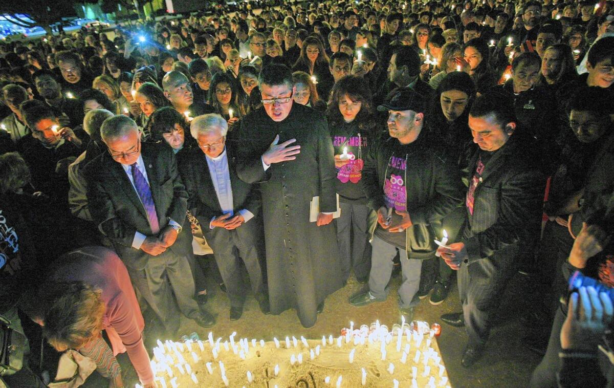 The Genocide Memorial is blessed at a candlelight vigil in the parking lot of the Glendale Civic Auditorium last April after a ceremony sponsored by United Young Armenians.