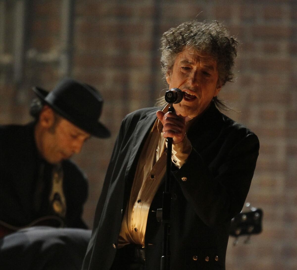 Bob Dylan, seen performing at the Grammy Awards in 2011, will tour the U.S. this summer.