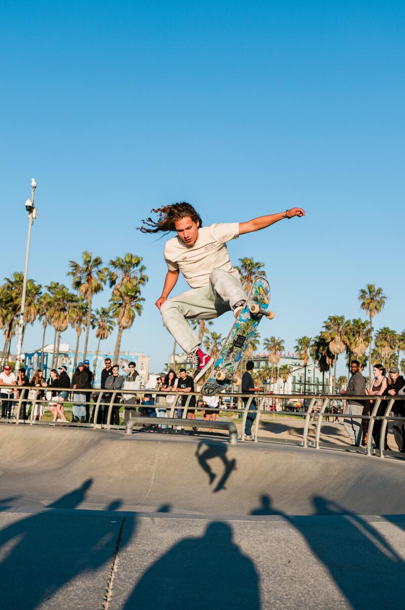 Venice, CA - April 03: A man throughs a trick at the skate park at Venice Beach on Wednesday, April 3, 2024 in Venice, CA. (Jason Armond / Los Angeles Times)