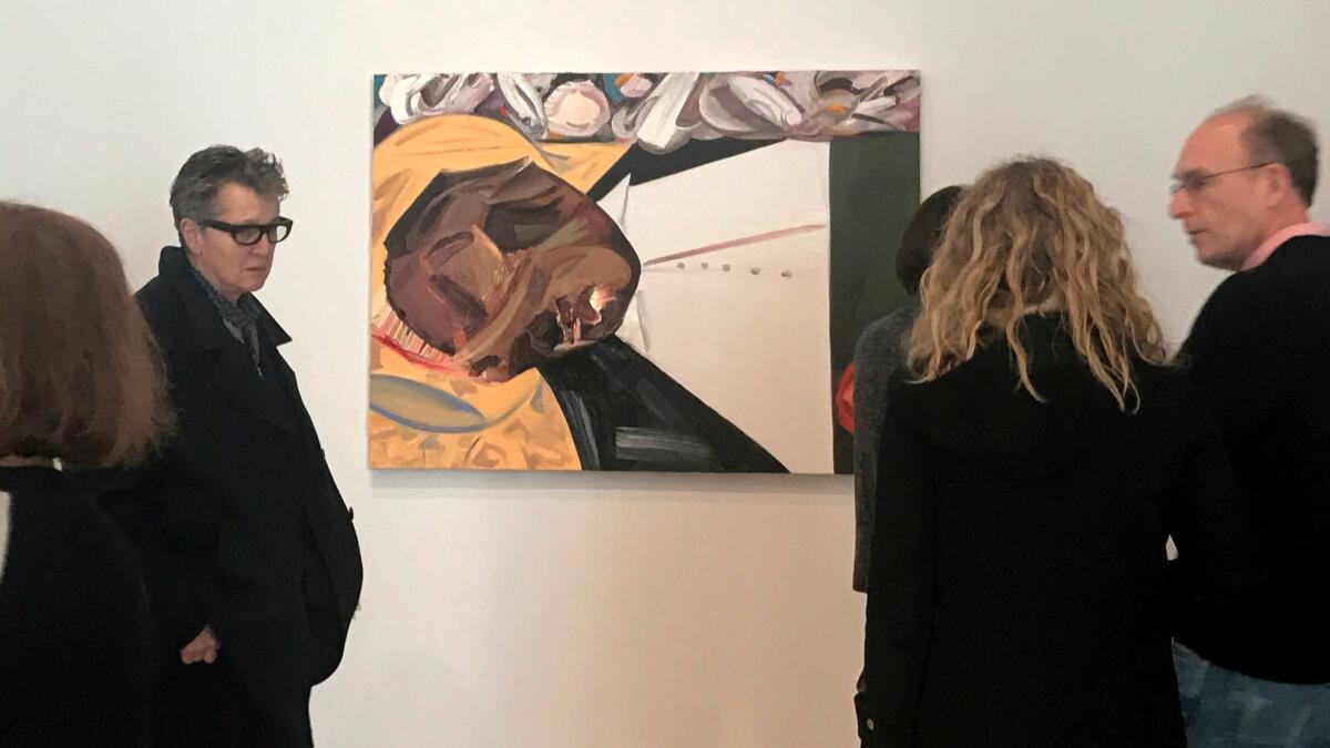 A group of museum-goers examine Dana Schutz's "Open Casket" at the Whitney Biennial earlier this year.