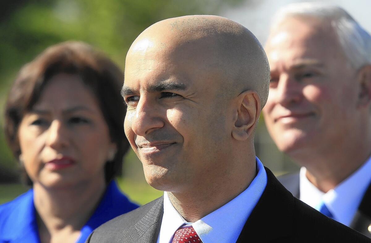 Republican gubernatorial candidate Neel Kashkari, shown here in March receiving endorsements from former U.S. Treasurer Rosario Marin, left, and Downey Councilman Mario Guerra, said Sunday that former President George W. Bush, 2012 presidential nominee Mitt Romney and other GOP leaders are aiding his campaign.