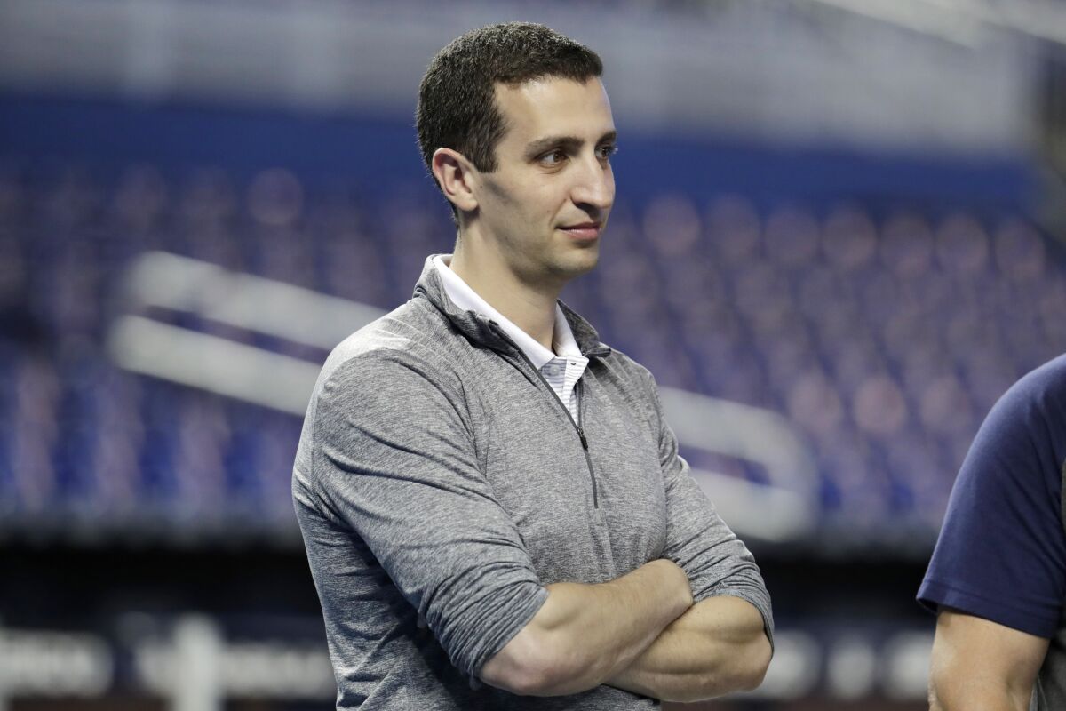 File-Milwaukee Brewers general manager David Stearns stands on the field before a baseball game against the Miami Marlins, Wednesday, Sept. 11, 2019, in Miami. Stearns says this year’s abbreviated schedule makes it difficult to evaluate his roster as he tries to make offseason improvements. (AP Photo/Lynne Sladky, File)