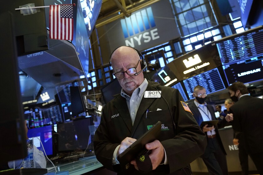 Trader John Doyle works on the floor of the New York Stock Exchange.