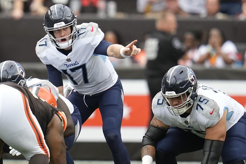 Tennessee Titans quarterback Ryan Tannehill (17) calls a play at the line of scrimmage during the first half of an NFL football game against the Cleveland Browns, Sunday, Sept. 24, 2023, in Cleveland. (AP Photo/Sue Ogrocki)