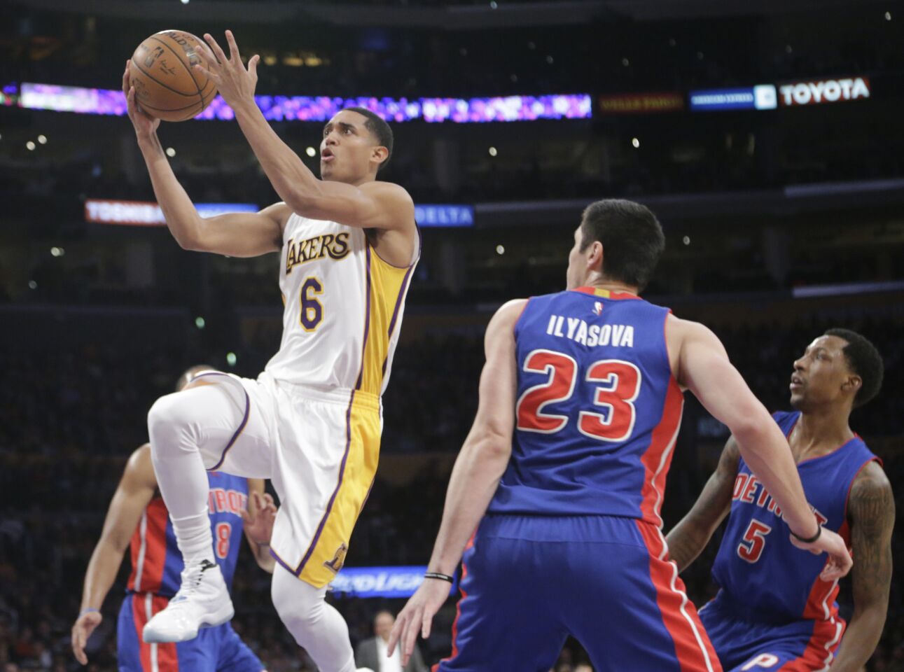 Lakers guard Jordan Clarkson goes up for a finger roll layup against the Pistons forward Ersan Ilyasova in the first half.
