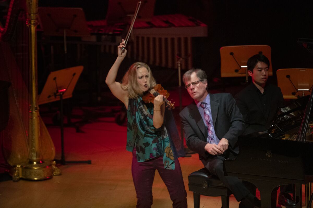 Violinist Leila Josefowicz and pianist John Novacek perform Oliver Knussen's "Reflection" during a tribute to the late British composer at the Walt Disney Concert Hall on Tuesday.