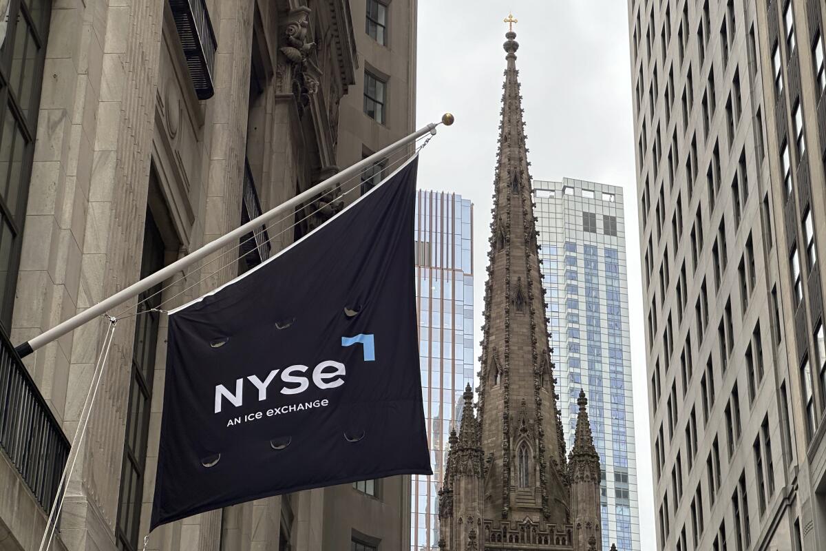 A flag hangs rom the side of the New York Stock Exchange