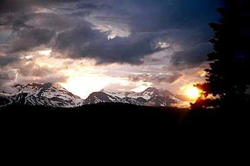 Storm clouds gather over the Rocky Mountains in Glacier National Park.