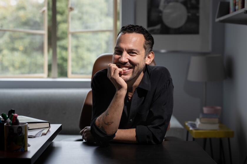 Los Angeles, CA - October 25: Novelist and UCLA professor, Justin Torres, is photographed in his Kaplan Hall office on campus, in Los Angeles, CA, Wednesday, Oct. 25, 2023. Torres has his second book, "Blackouts: A Novel," out this month. (Jay L. Clendenin / Los Angeles Times)