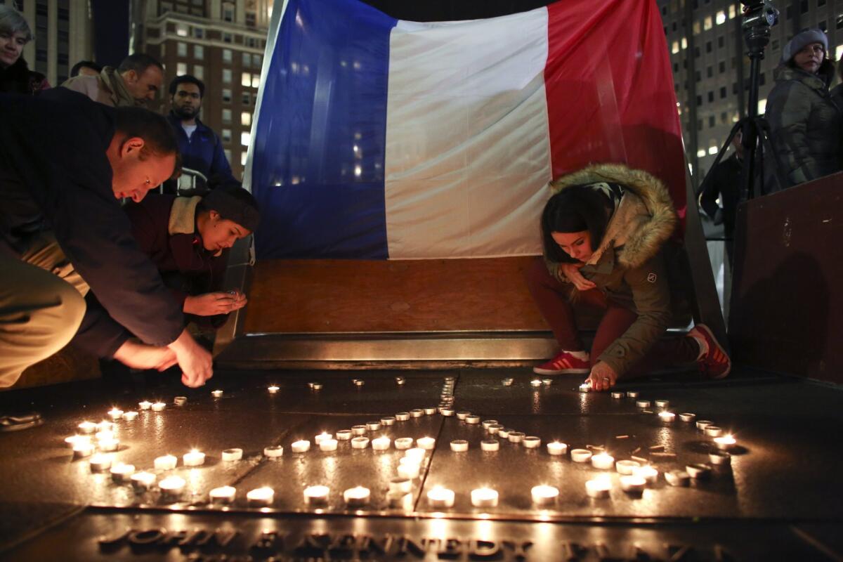 Candles are lit in the shape of a peace symbol in LOVE Park, during a vigil to remember the victims of the attacks in Paris.