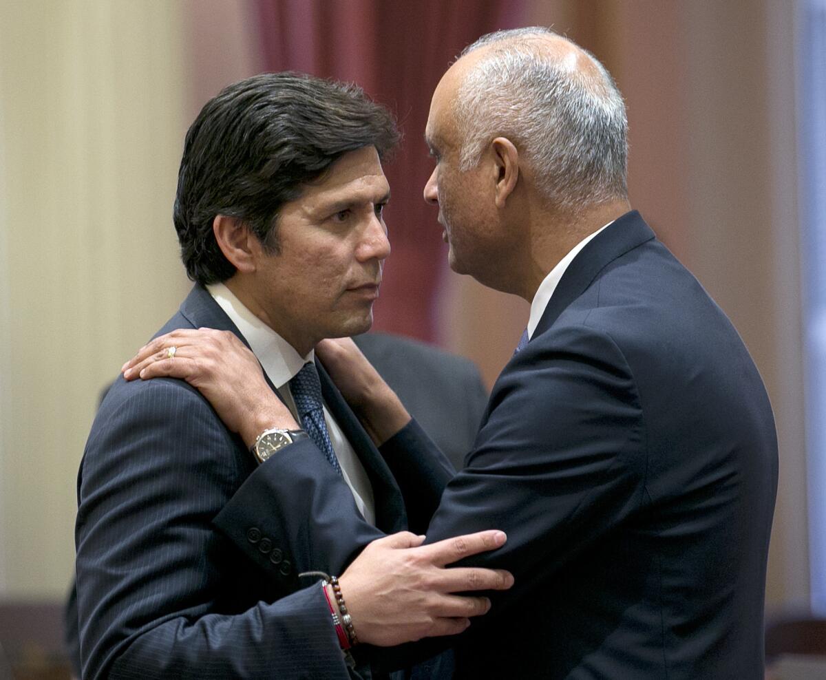 Senate President Pro Tem Kevin de León, left, and state Sen. Ed Hernandez during a Senate session in July.