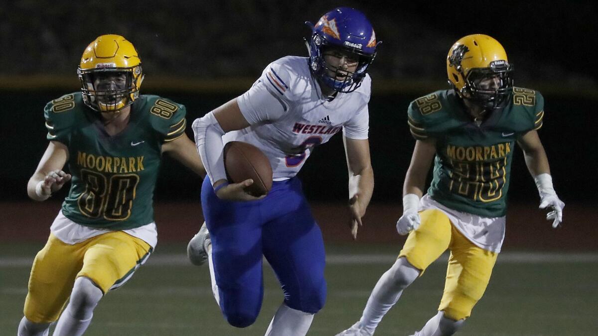 Westlake quarterback Patrick Roberg scrambles for a long gain against Moorpark during the second half Friday night.