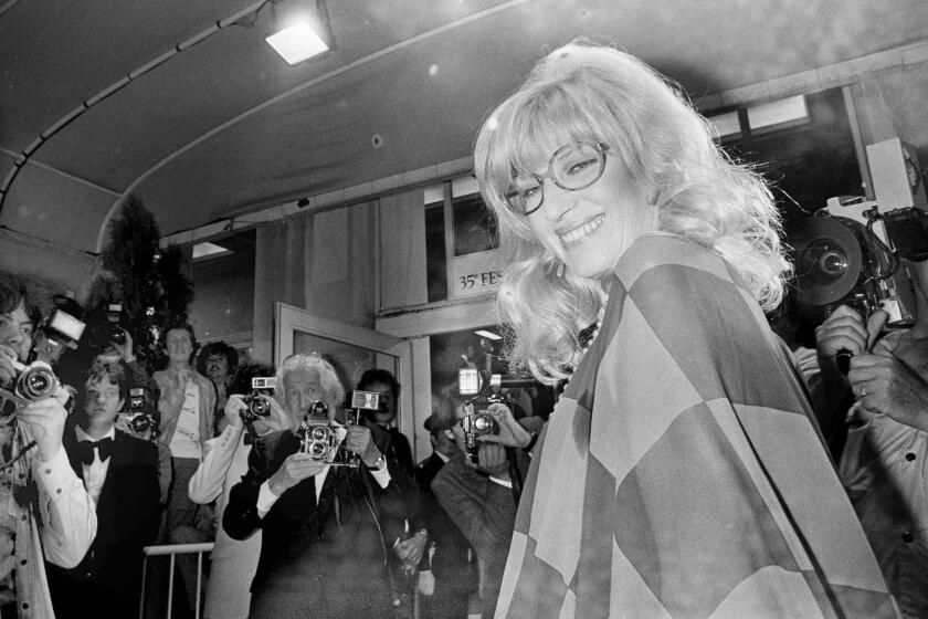 FILE - Italian actress Monica Vitti arrives at the Festival Palace to see director Michelangelo Antonioni's film "Identificazione di una Donna" (Identification of a Woman), the Italian entry at the 35 annual Cannes Film Festival in Cannes, France, May 23, 1982. Monica Vitti, the versatile blond star of Michelangelo Antonioni's "L'Avventura" and other Italian alienation films of the 1960s, and later a leading comic actress, has died. She was 90. (AP Photo/Jean Jacques Levy, File)