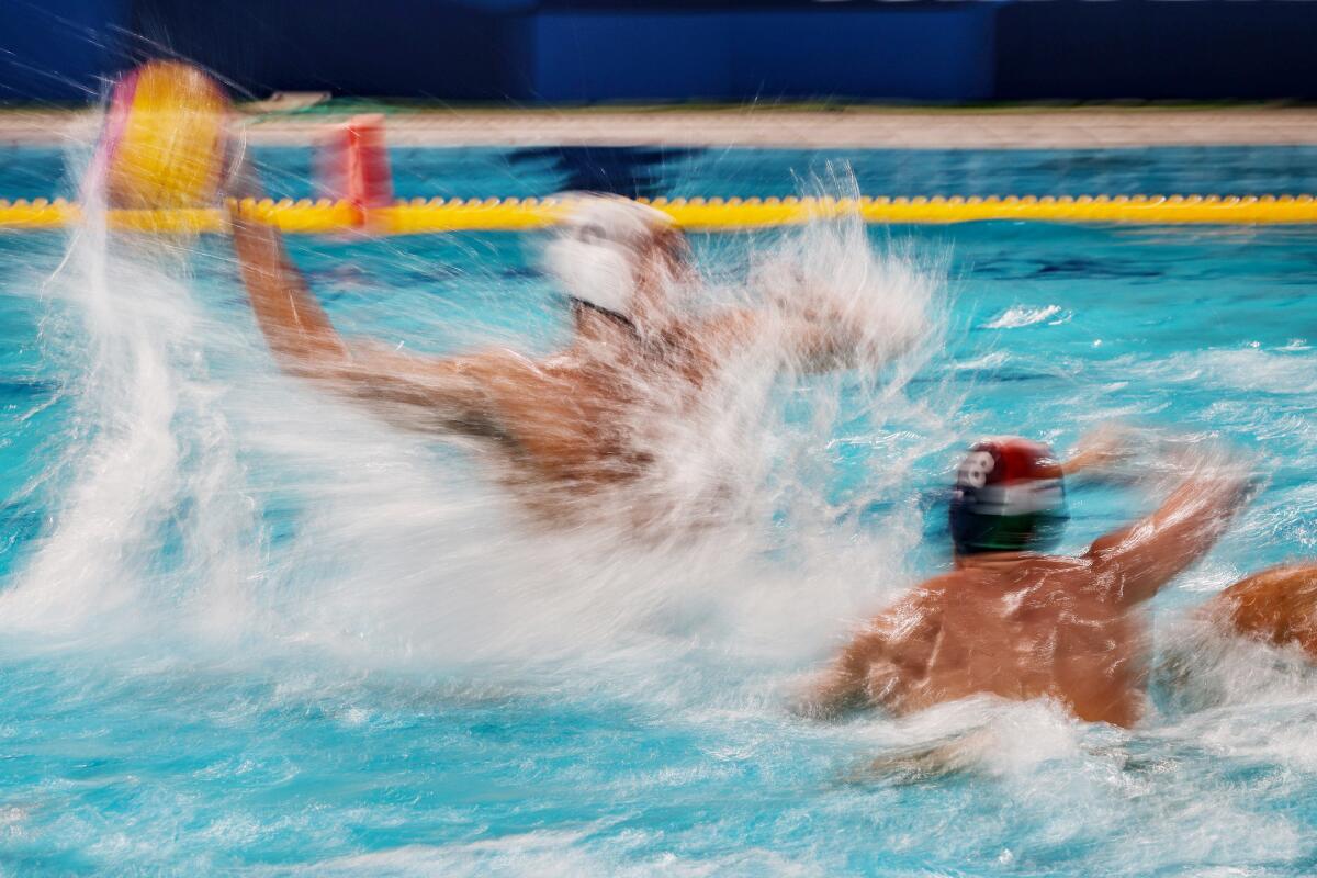 Team United States driver Luca Cupido (6) shoots as Team Hungary centre back Szilard Jansik (8) tries to block