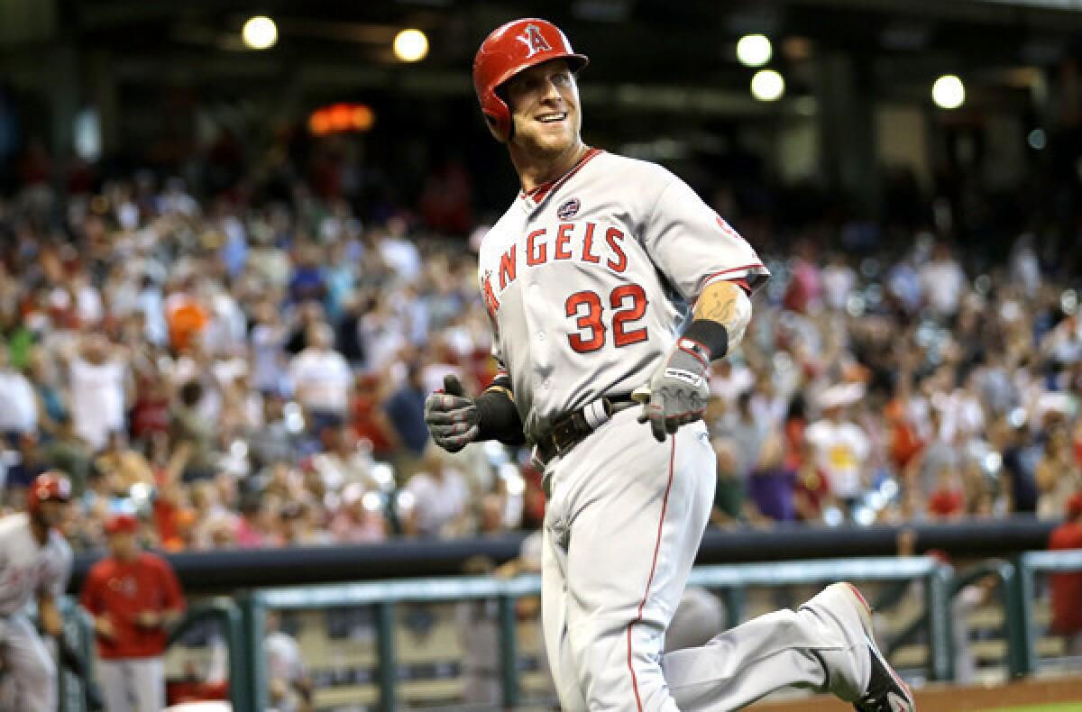 Angels right fielder Josh Hamilton reacts after doubling and coming all the way home on the play in the eighth inning Sunday in Houston.