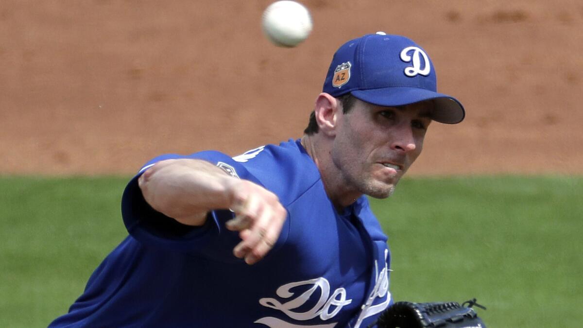 Dodgers right-hander Brandon McCarthy seems almost a lock to earn one of the final two rotation spots, but Manager Dave Roberts is noncommittal. (Matt York / Associated Press)