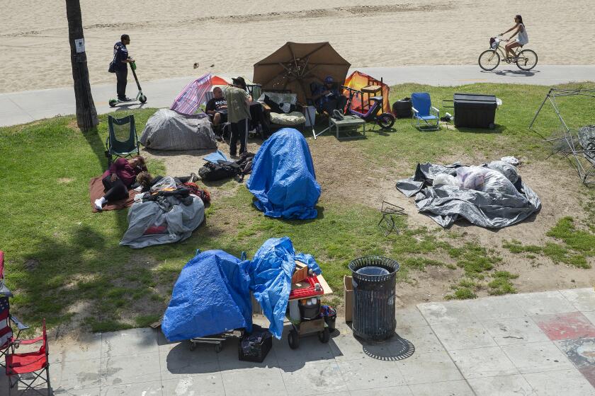 VENICE, CA-APRIL 25, 2019: Overall, shows a homeless encampment on Ocean Front Walk in Venice Beach. There is a fight over a proposed homeless shelter in Venice being built. (Mel Melcon/Los Angeles Times)