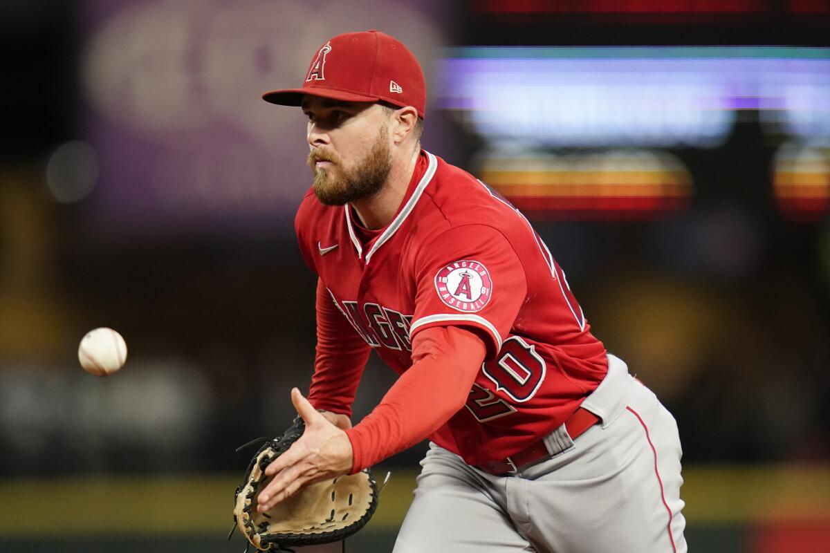 Angels first baseman Jared Walsh makes a fielding play against the Seattle Mariners on Saturday night.