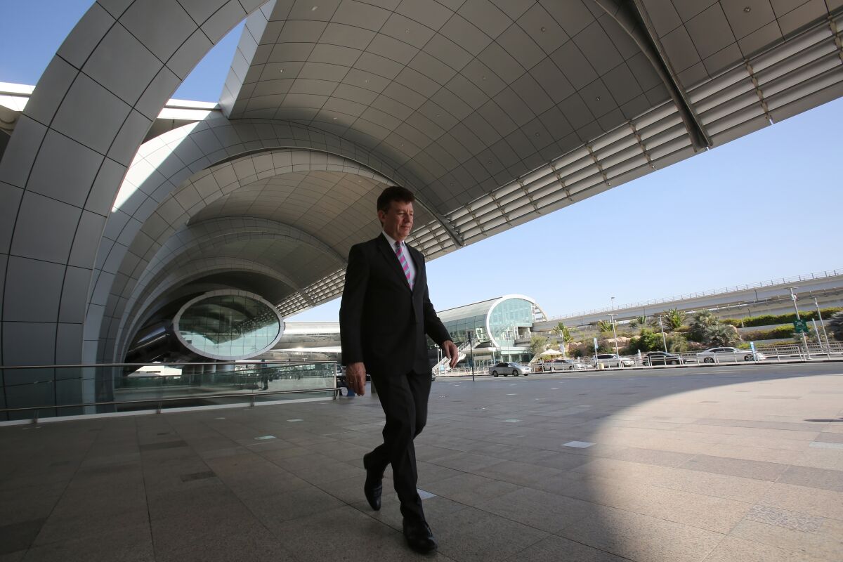 FILE - Dubai Airports CEO Paul Griffiths walks out of the Dubai International Airport's Terminal 3 in Dubai, United Arab Emirates, June 17, 2014. Dubai International Airport, the world's busiest for international travel, announced on Thursday it handled over 13.6 million passengers in the first three months of 2022 — more than double last year's number in a clear sign that a long-awaited travel revival has come to the global aviation hub. (AP Photo/Kamran Jebreili, File)