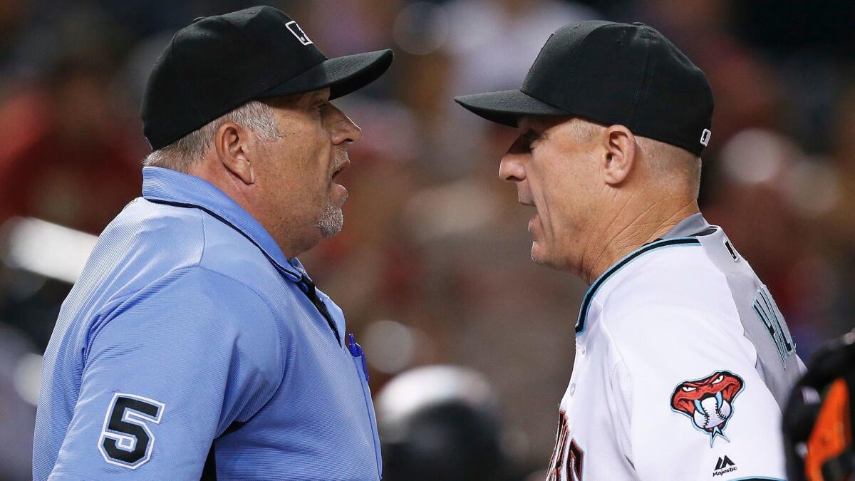 Umpire Dale Scott, left, argues with the Arizona Diamondbacks' Chip Hale on Sept. 10, 2016.