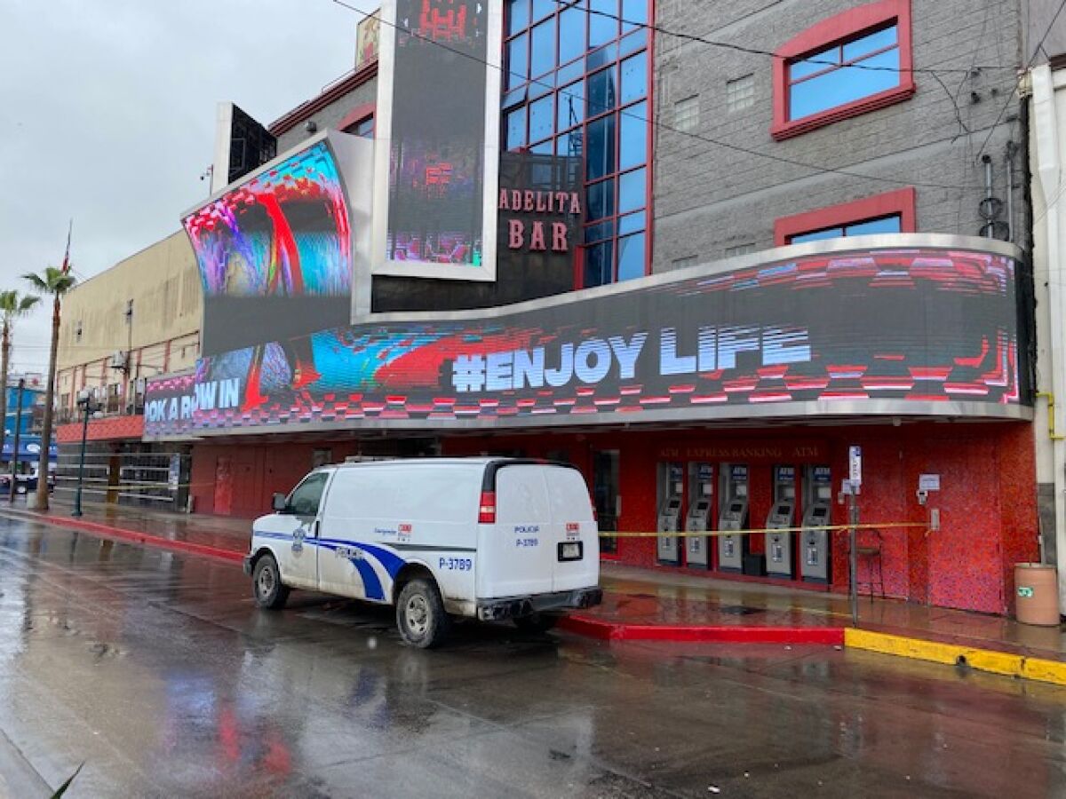 Caution tape is visible around the entrance of Adelita Bar in Tijuana's Zona Norte